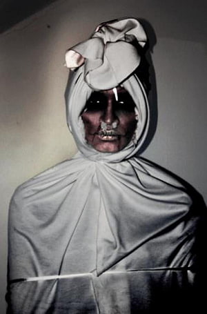 Creepy Figure in White Hooded Garment with Dark Face and Glowing Eyes HD phone wallpaper