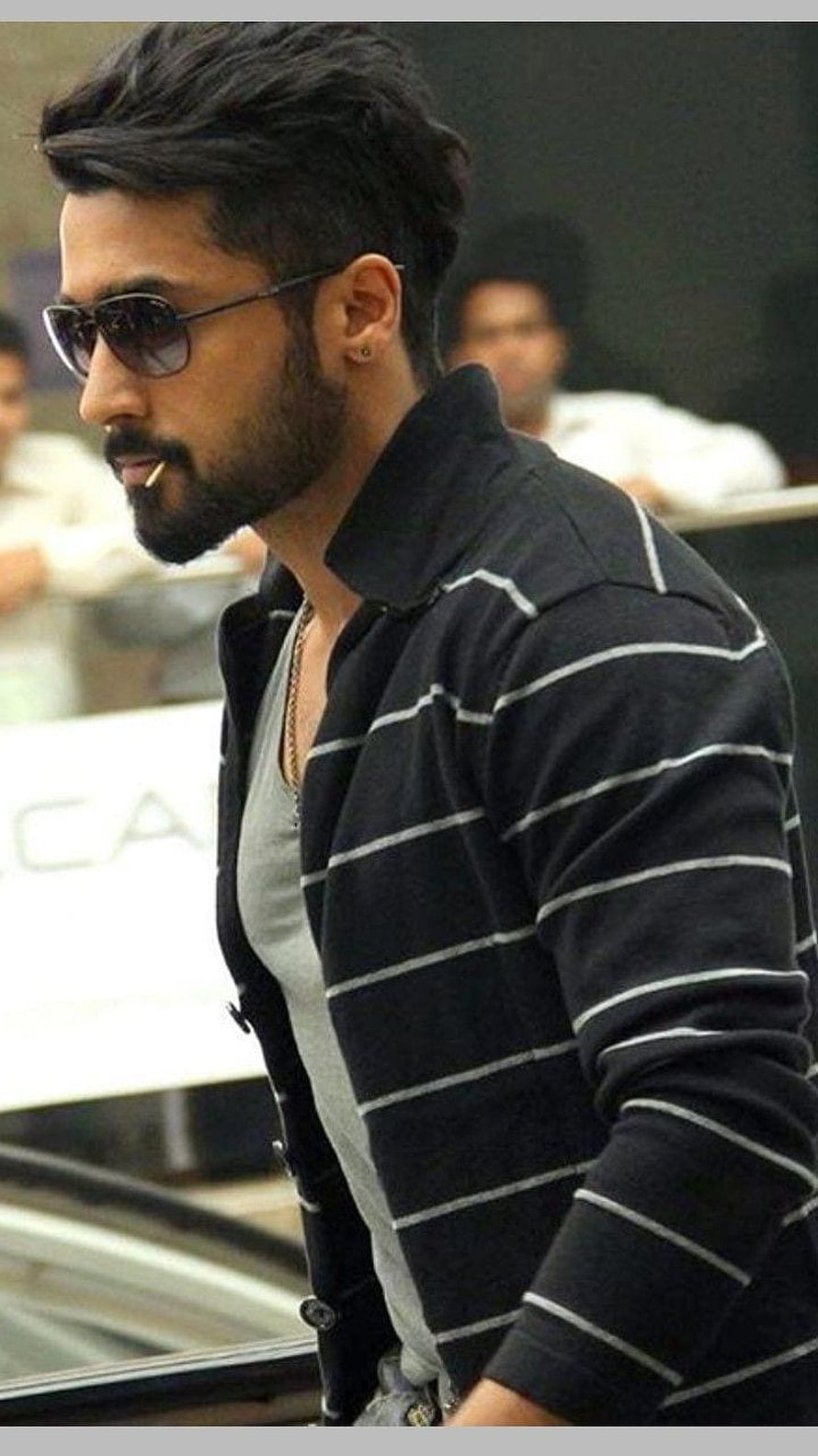 Surya in a black striped jacket and sunglasses with a full beard HD phone wallpaper