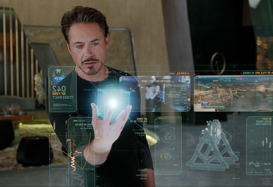 Tony Stark Interacting with Futuristic Holographic Interface in Avengers Movie Scene HD wallpaper