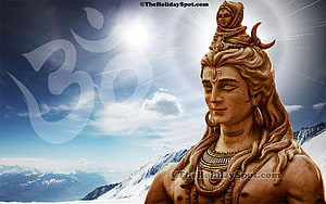 Statue of Lord Shiva in Meditation with Om Symbol and Snowy Mountains HD wallpaper