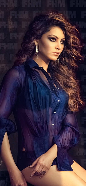 Urvashi Rautela in a sheer blue blouse with dramatic makeup and voluminous wavy hair HD phone wallpaper