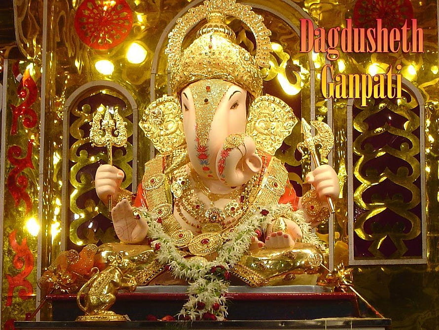 Dagdusheth Ganpati Murti Adorned in Gold Jewelry and Floral Garland HD wallpaper