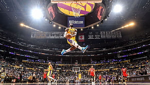 LeBron James Mid-Air Dunk at Los Angeles Lakers Home Game HD wallpaper