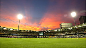 Walakea Cricket Stadium at Sunset with Vibrant Sky and Floodlights HD wallpaper