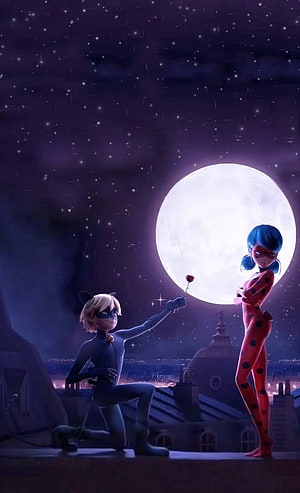 Miraculous Ladybug and Cat Noir Kneeling Under a Full Moon on a Paris Rooftop HD phone wallpaper