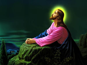 Jesus Christ Praying on a Rock at Night with a Glowing Halo and Distant Village HD wallpaper