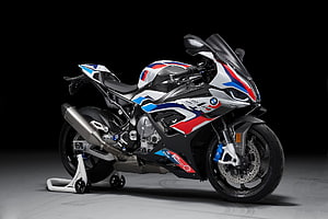 BMW M1000RR M Performance Edition Sport Motorcycle in Studio Setting HD wallpaper