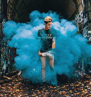 Danish Zehen in a Graffiti Tunnel with Blue Smoke and Gucci Tee HD phone wallpaper