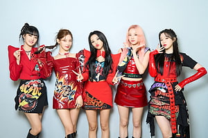 GIDLE Members in Bold Red and Black Rock-Inspired Stage Outfits HD wallpaper