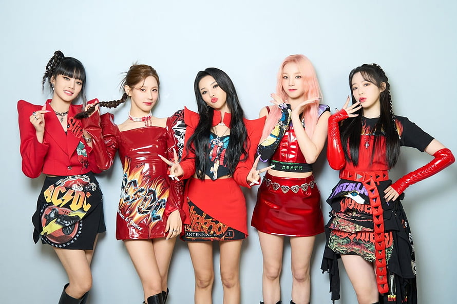 GIDLE Members in Bold Red and Black Rock-Inspired Stage Outfits HD wallpaper