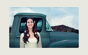 Lana Del Rey in Vintage Green Truck with Floral Hair Accessories HD wallpaper