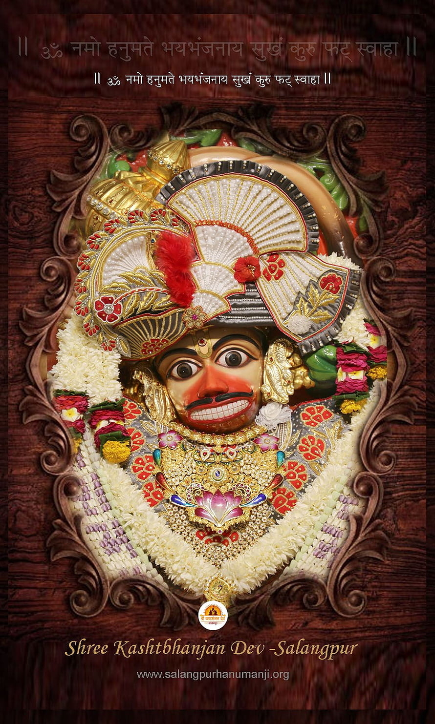 Kashtbhanjan Dev Murti at Salangpur Temple with Floral Garlands and Ornate Crown HD phone wallpaper