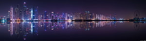 Panoramic Night View of Dubai Marina Skyline with Reflections in Water HD wallpaper