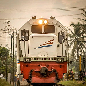 Front View of an Indonesian Electric Locomotive on a Tropical Railway Line HD phone wallpaper