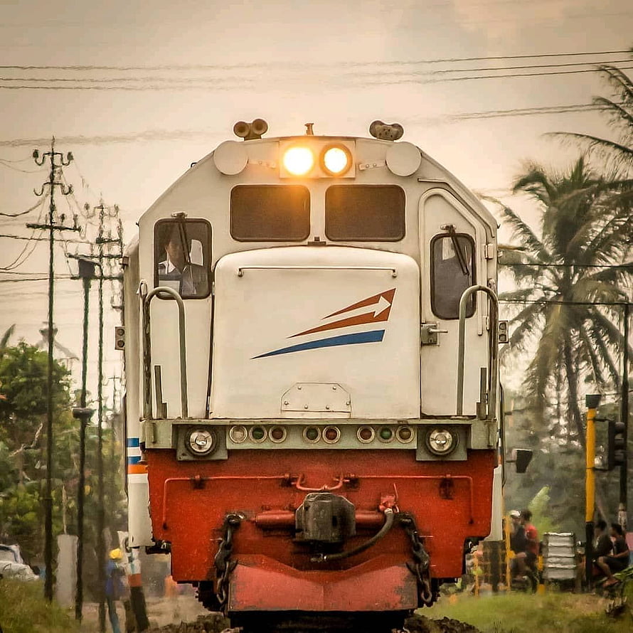 Front View of an Indonesian Electric Locomotive on a Tropical Railway Line HD phone wallpaper