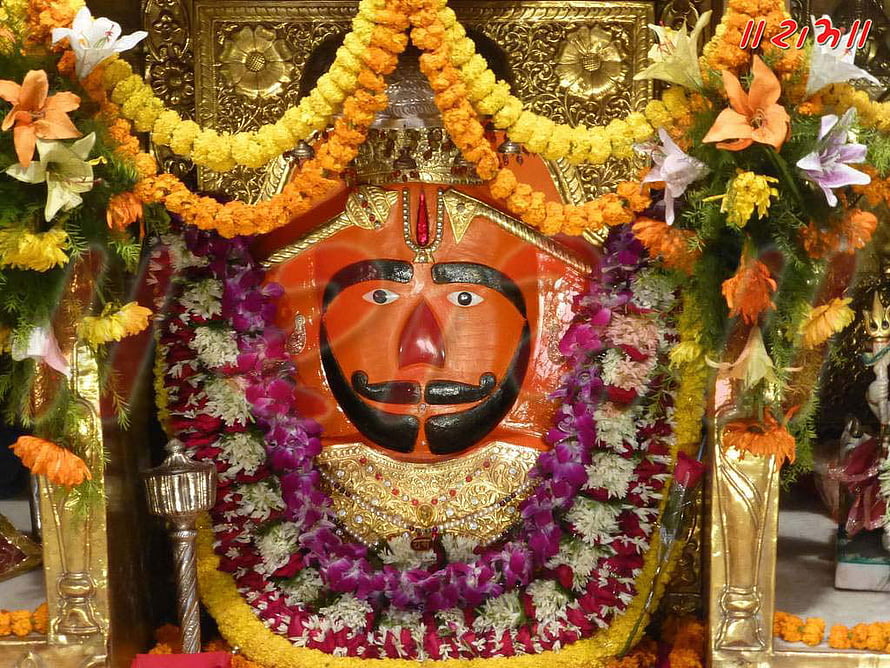 Salasar Balaji Temple Idol Adorned With Vibrant Marigold And Jasmine Flower Garlands HD wallpaper