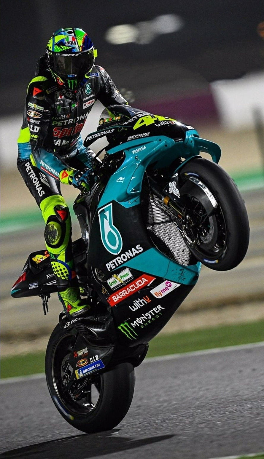 Valentino Rossi on Yamaha Petronas MotoGP Bike Performing Wheelie at Sepang HD phone wallpaper