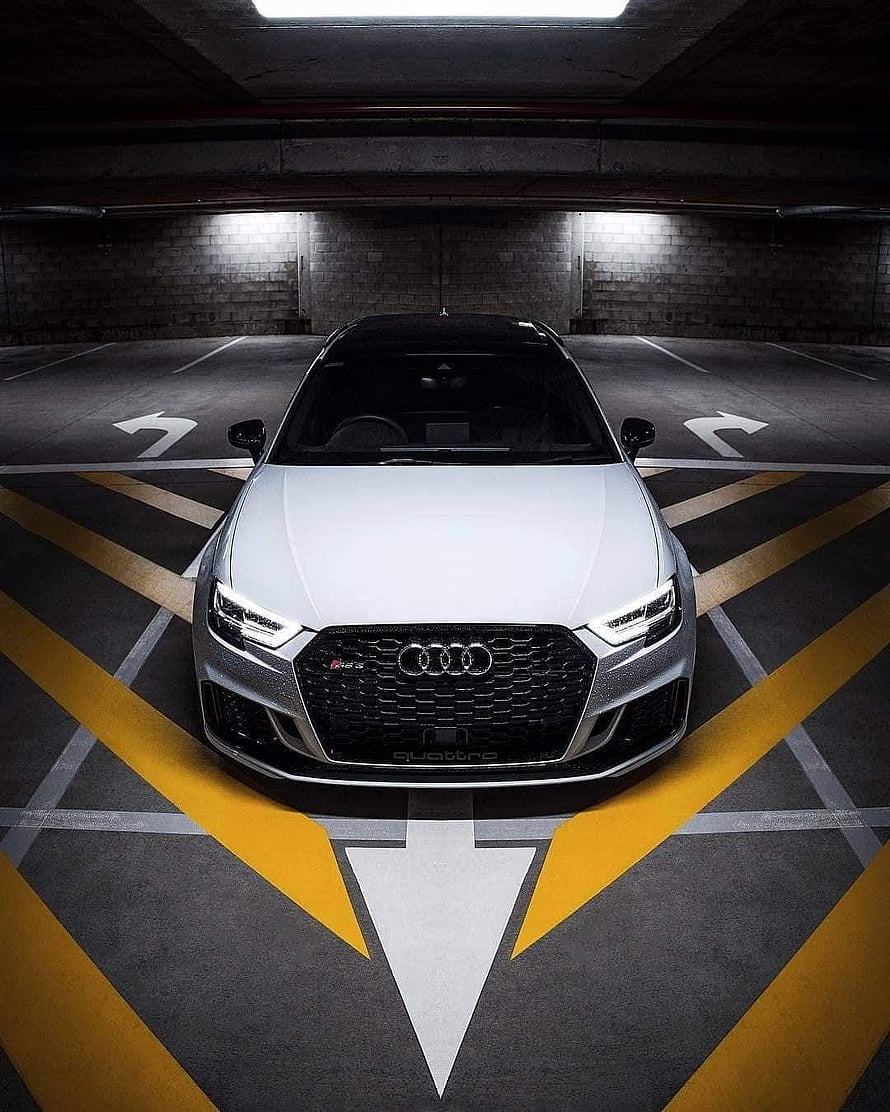 Audi RS3 Sedan Front View in Underground Parking Garage with Yellow Markings HD phone wallpaper