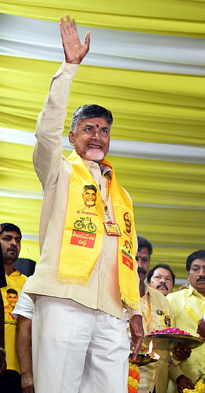 N. Chandrababu Naidu Waving at Political Rally in Yellow Campaign Attire HD phone wallpaper
