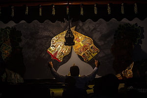 Traditional Indonesian Wayang Kulit Shadow Puppet Performance with Lantern HD wallpaper