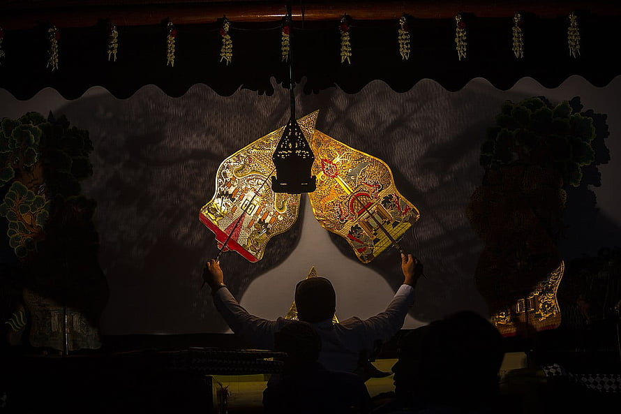 Traditional Indonesian Wayang Kulit Shadow Puppet Performance with Lantern HD wallpaper