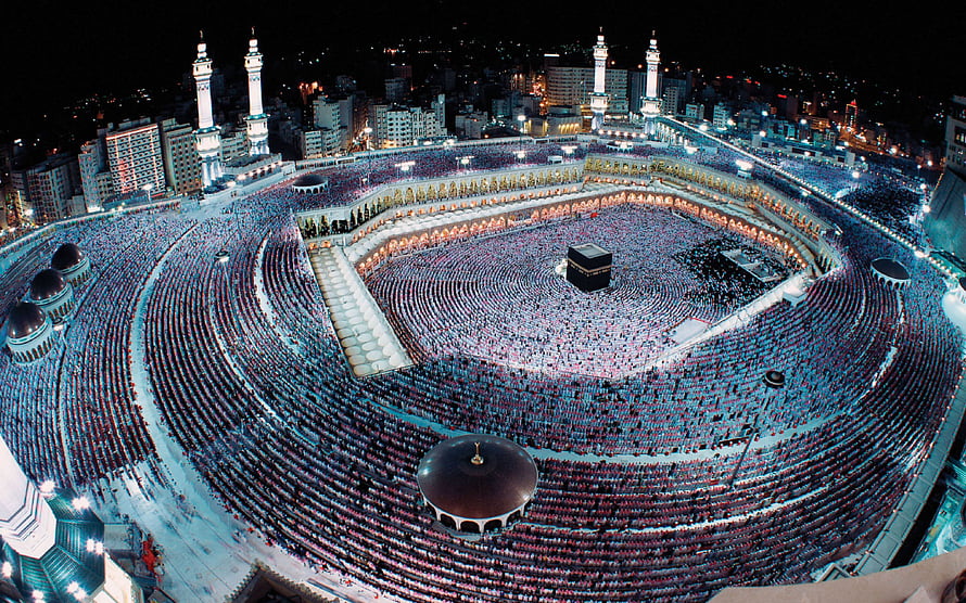 Aerial Night View of the Grand Mosque in Mecca with Pilgrims Circling the Kaaba HD wallpaper