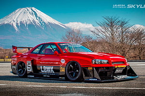 Red Nissan Skyline GT-R LB-ER34 Widebody with Mount Fuji Background HD wallpaper