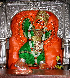 Colorful Statue of Lord Ayyappa in Green Vestments and Golden Crown HD phone wallpaper
