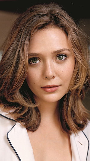 Elizabeth Olsen Close-Up Portrait with Wavy Brown Hair and Green Eyes HD phone wallpaper