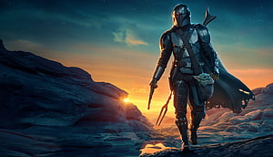 The Mandalorian and Grogu Walking Through Rocky Desert at Sunset HD wallpaper