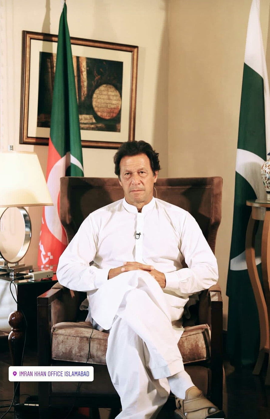 Imran Khan Sitting in Office Chair with Pakistan and Afghanistan Flags HD phone wallpaper