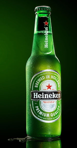 Chilled Heineken Beer Bottle with Condensation on Dark Green Background HD phone wallpaper