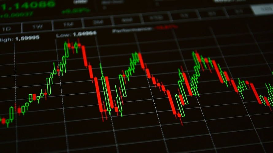 Candlestick Stock Market Chart Displaying Volatile Price Movements on a Dark Trading Screen HD wallpaper