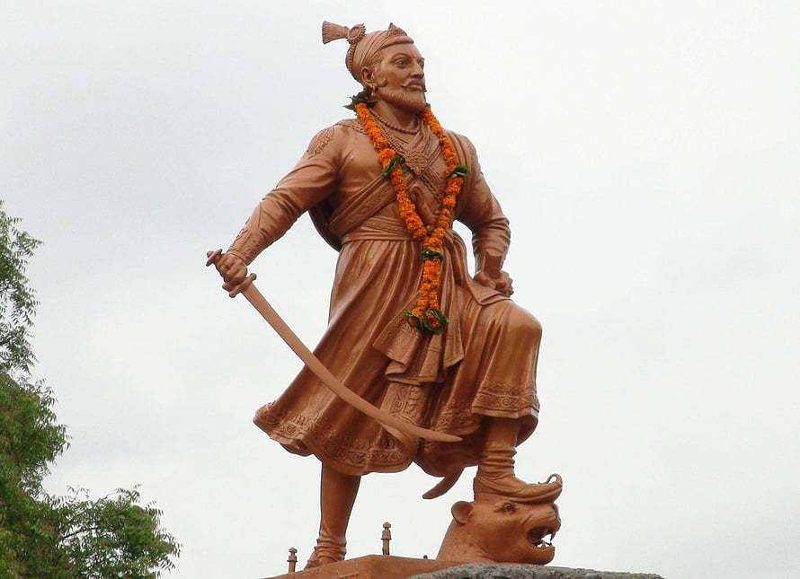 Sambhaji Maharaj Bronze Statue Holding Sword and Marigold Garland HD wallpaper