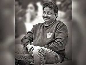 Ram Gopal Varma in a relaxed black and white portrait wearing an NFL sweatshirt HD wallpaper