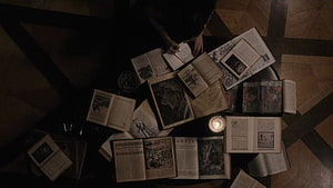 Dark Academia Aesthetic with Open Books and Candlelight on a Patterned Floor HD wallpaper