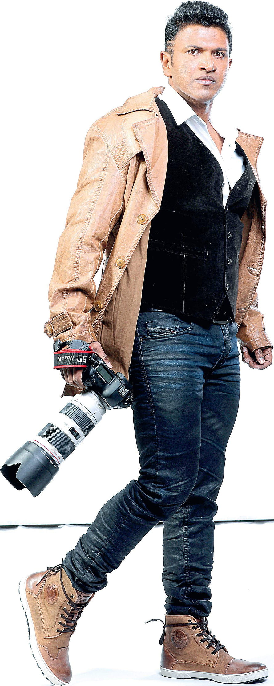 Punith Rajkumar in Tan Leather Jacket and Black Vest Holding DSLR Camera HD phone wallpaper