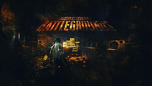PlayerUnknown's Battlegrounds Dark Industrial Interior with Glowing Logo and Lone Soldier HD wallpaper