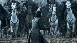 Jon Snow standing alone with sword facing charging cavalry in Game of Thrones HD wallpaper