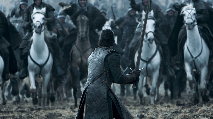 Jon Snow standing alone with sword facing charging cavalry in Game of Thrones HD wallpaper