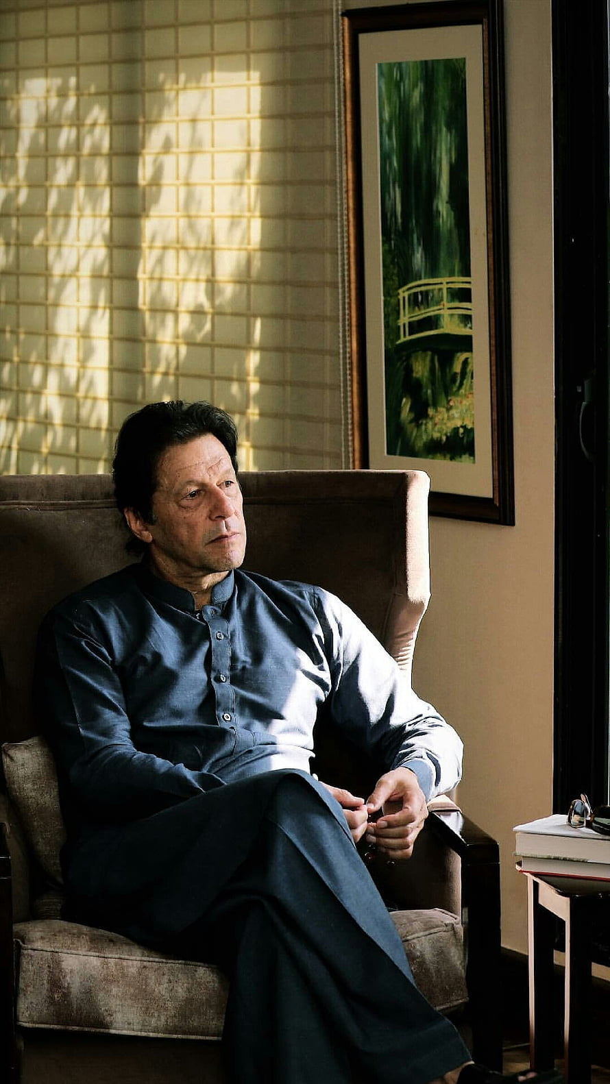 Imran Khan Sitting in a Chair Wearing Traditional Blue Shalwar Kameez Portrait HD phone wallpaper