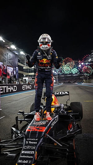 Max Verstappen Celebrates Victory Standing on Red Bull Racing Car at Night Race HD phone wallpaper