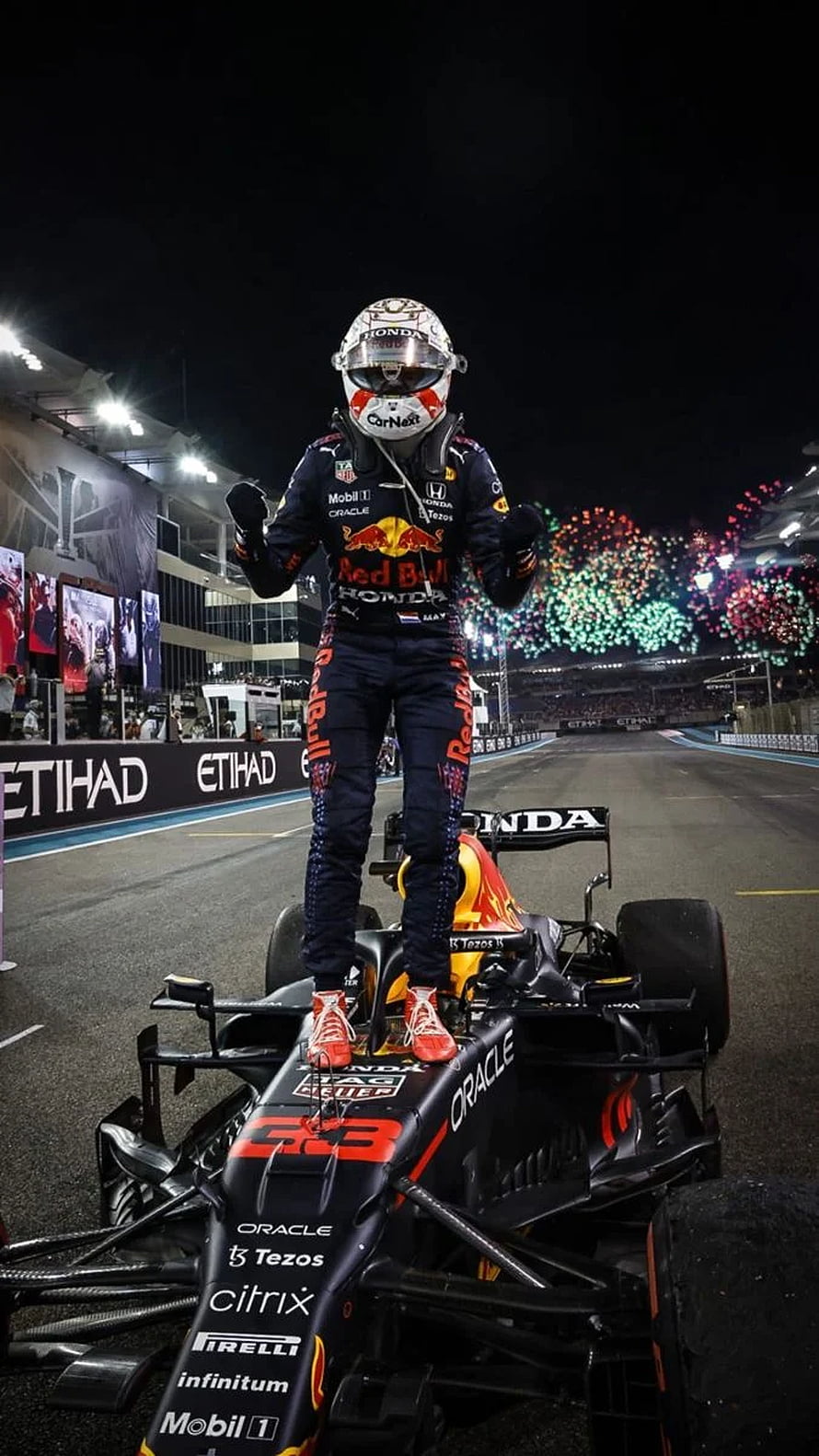 Max Verstappen Celebrates Victory Standing on Red Bull Racing Car at Night Race HD phone wallpaper