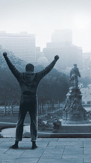 Rocky Balboa Standing With Raised Fists In Philadelphia Cityscape HD phone wallpaper