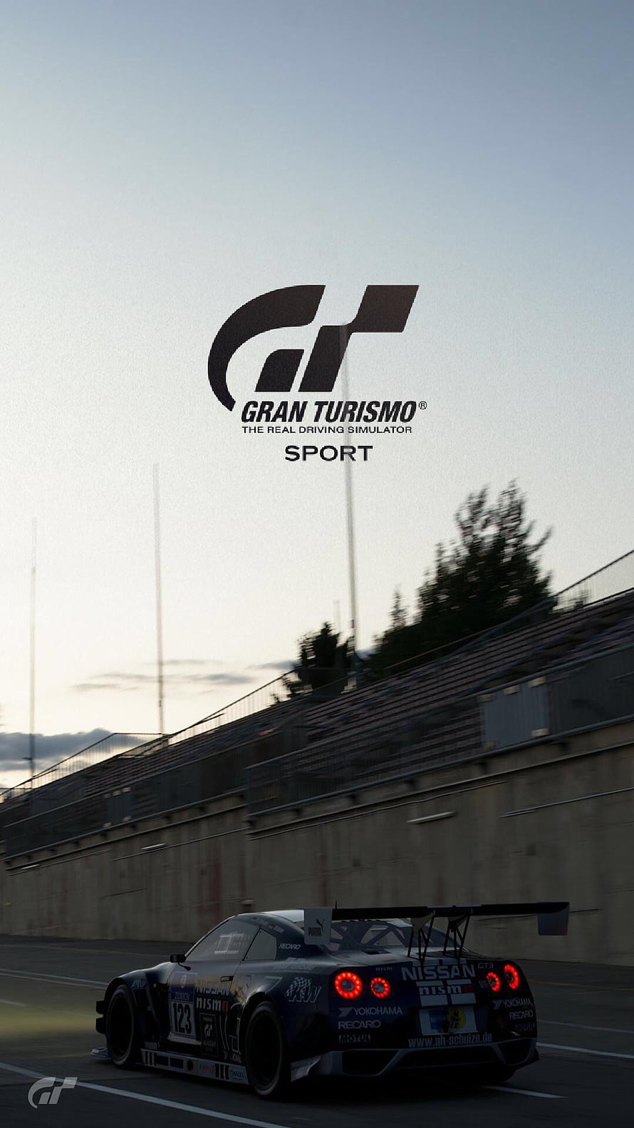 Gran Turismo Sport Nissan GT-R Nismo GT3 race car on track at dusk HD phone wallpaper