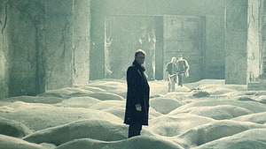 Stalker Film Scene: Men in a Desolate Ruined Hall with Mounds of Sand HD wallpaper