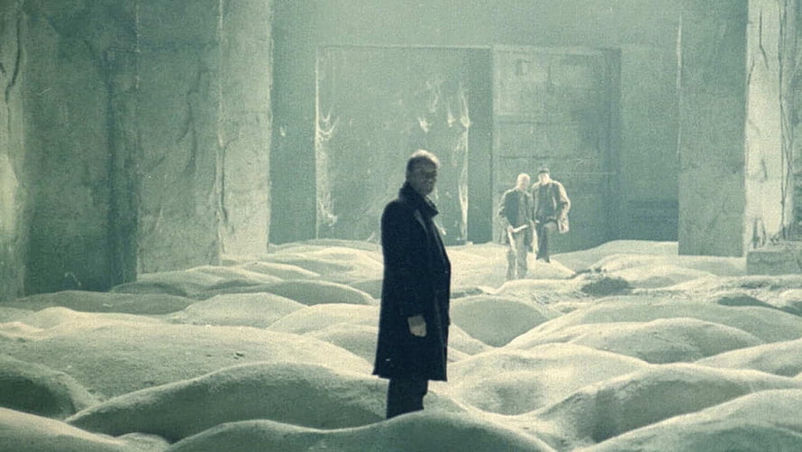 Stalker Film Scene: Men in a Desolate Ruined Hall with Mounds of Sand HD wallpaper