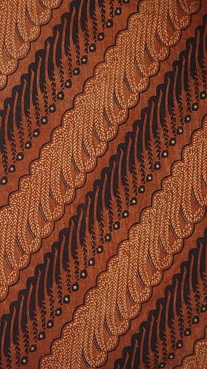 Traditional Indonesian Batik Textile with Intricate Brown and Black Floral Patterns HD phone wallpaper
