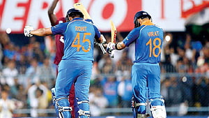 Virat Kohli and Rohit Sharma Celebrate Partnership in Blue India Cricket Jerseys HD wallpaper