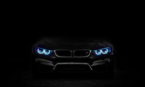 BMW M4 Front Fascia with Blue LED Headlights in Dark Studio Setting HD wallpaper